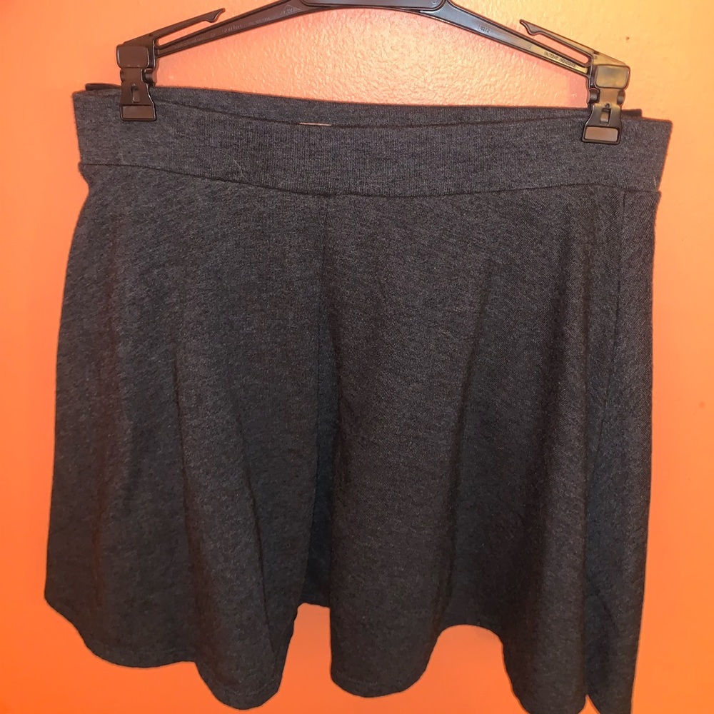 Charcoal skater skirt + additional black skirt.